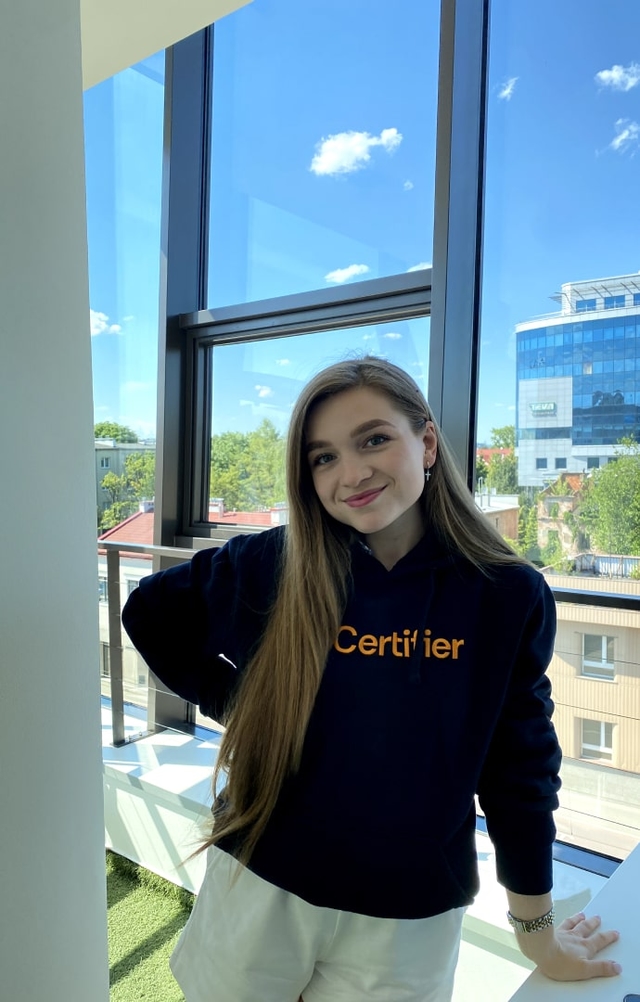 Our product guru Uliana in Certifier's new hoodie